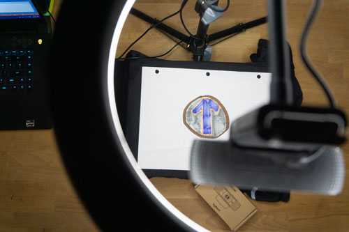 Image of prototype station looking down through selfie light ring to drawing on table below..